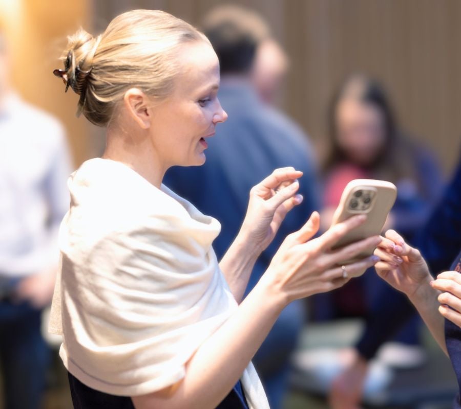 User holding phone to symbolize how important customer identity and access management (CIAM) is as connective layer